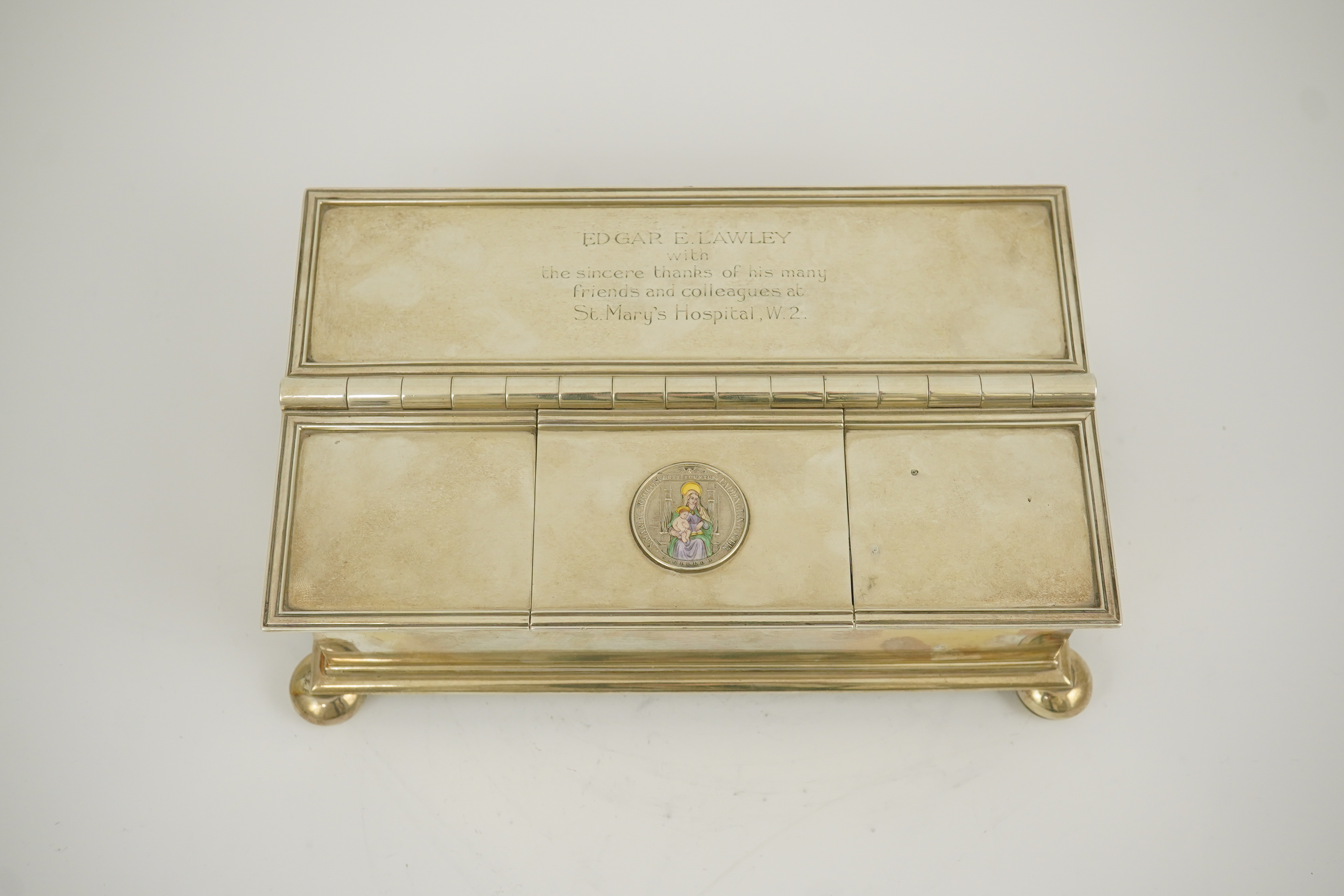 A George V Britannia standard silver and enamel combination ‘treasury inkstand/ cigarette box, by Crichton Brothers